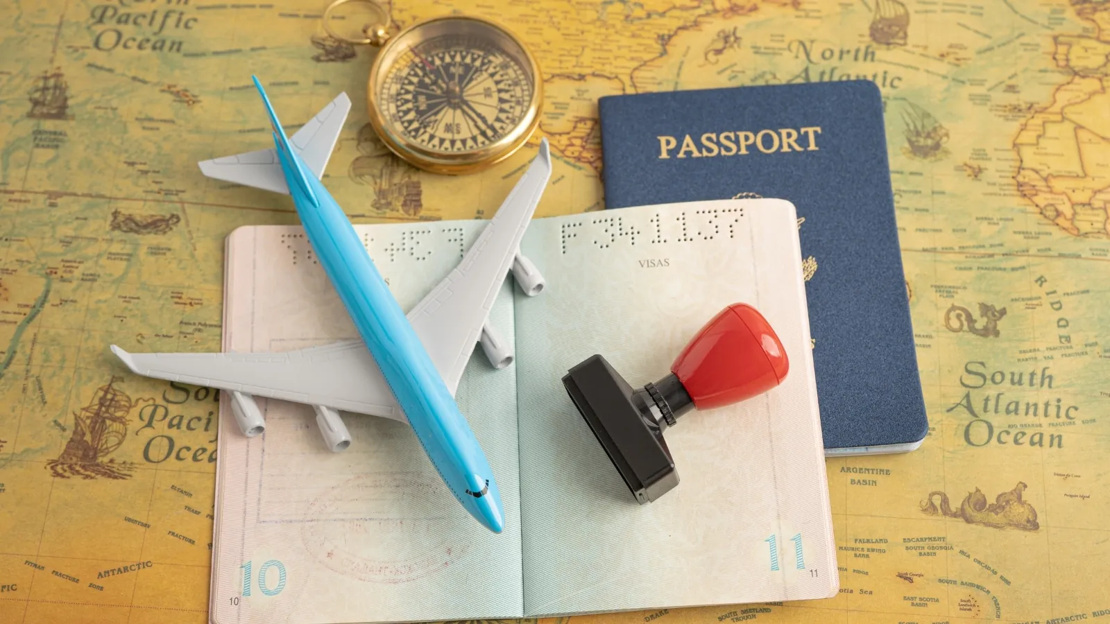Travel planning with compass, map and passport