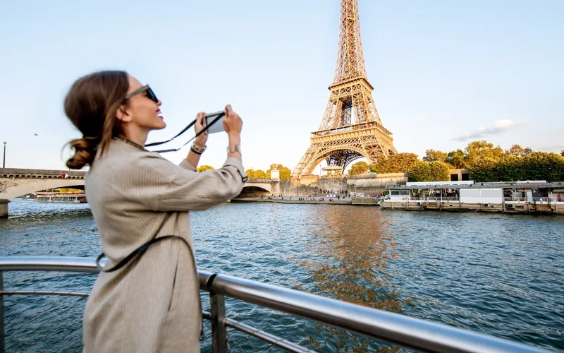 Tourist photographing the Eiffel Tower in Paris